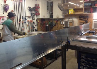 Wall Panel System with Adjustable Display: Welding Shots for Shelf Engagement